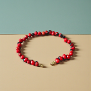 Image of a combo featuring two bracelets made of black and red Gunja seeds, arranged side by side on a clean white background