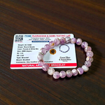 Image of a natural Amethyst bracelet with polished 8mm deep purple beads, arranged in a circular shape on a light background