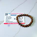 Image of a natural Tiger Eye bracelet made of 8mm golden-brown beads with a silky shine, arranged in a circular shape on a neutral background