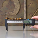 Image of a natural Tiger Eye bracelet made of 8mm golden-brown beads with a silky shine, arranged in a circular shape on a neutral background