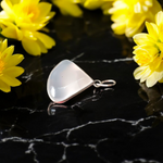 Image of a polished oval Natural Milky Moonstone Pendant on a black adjustable cotton thread, displayed on a neutral background