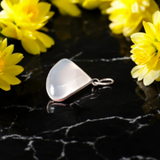 Image of a polished oval Natural Milky Moonstone Pendant on a black adjustable cotton thread, displayed on a neutral background