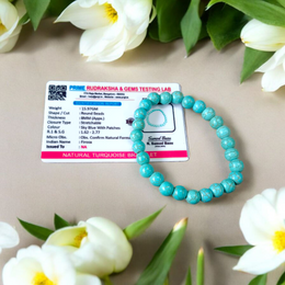 Image of a stretchable turquoise gemstone bracelet made with smooth 8mm beads on a white background