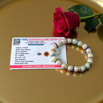 Image of an original pearl bracelet with smooth, polished 8mm white pearls arranged in a circle on a soft neutral background