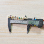 Image of an original pearl bracelet with smooth, polished 8mm white pearls arranged in a circle on a soft neutral background