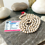 Image showing a combo of Tulsi Mala and Sphatik Mala with traditional guru beads, neatly arranged on a spiritual cloth background