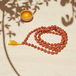 Image showing a combo of brown Rudraksha Mala (108 beads) and a single 3 Mukhi Rudraksha Pendant, both lab certified and handcrafted for spiritual use