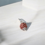 Image showing a complete set of 5 Mukhi Rudraksha Mala and a matching Rudraksha Pendant with metal capping on a spiritual background
