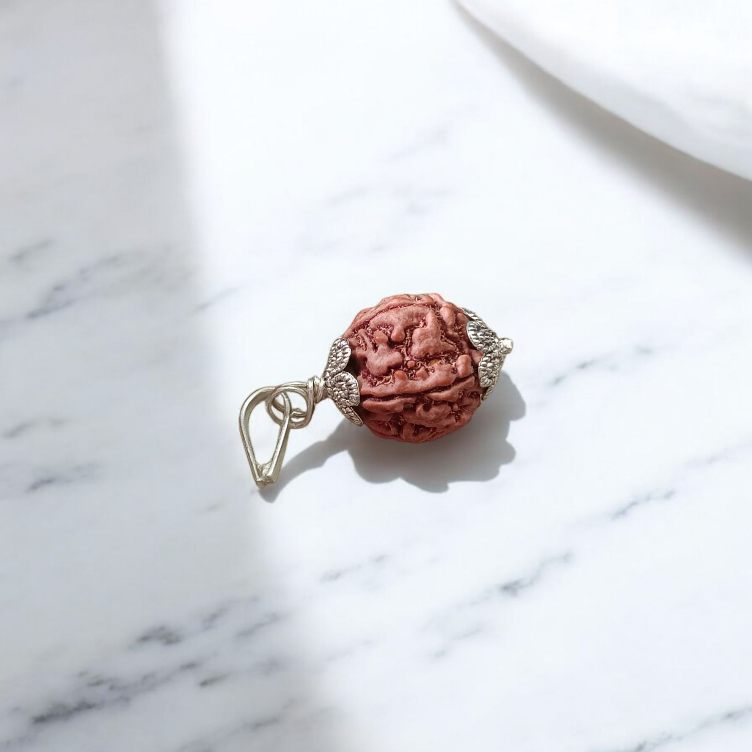 Image showing a complete set of 5 Mukhi Rudraksha Mala and a matching Rudraksha Pendant with metal capping on a spiritual background