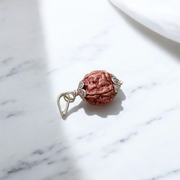 Image showing a complete set of 5 Mukhi Rudraksha Mala and a matching Rudraksha Pendant with metal capping on a spiritual background