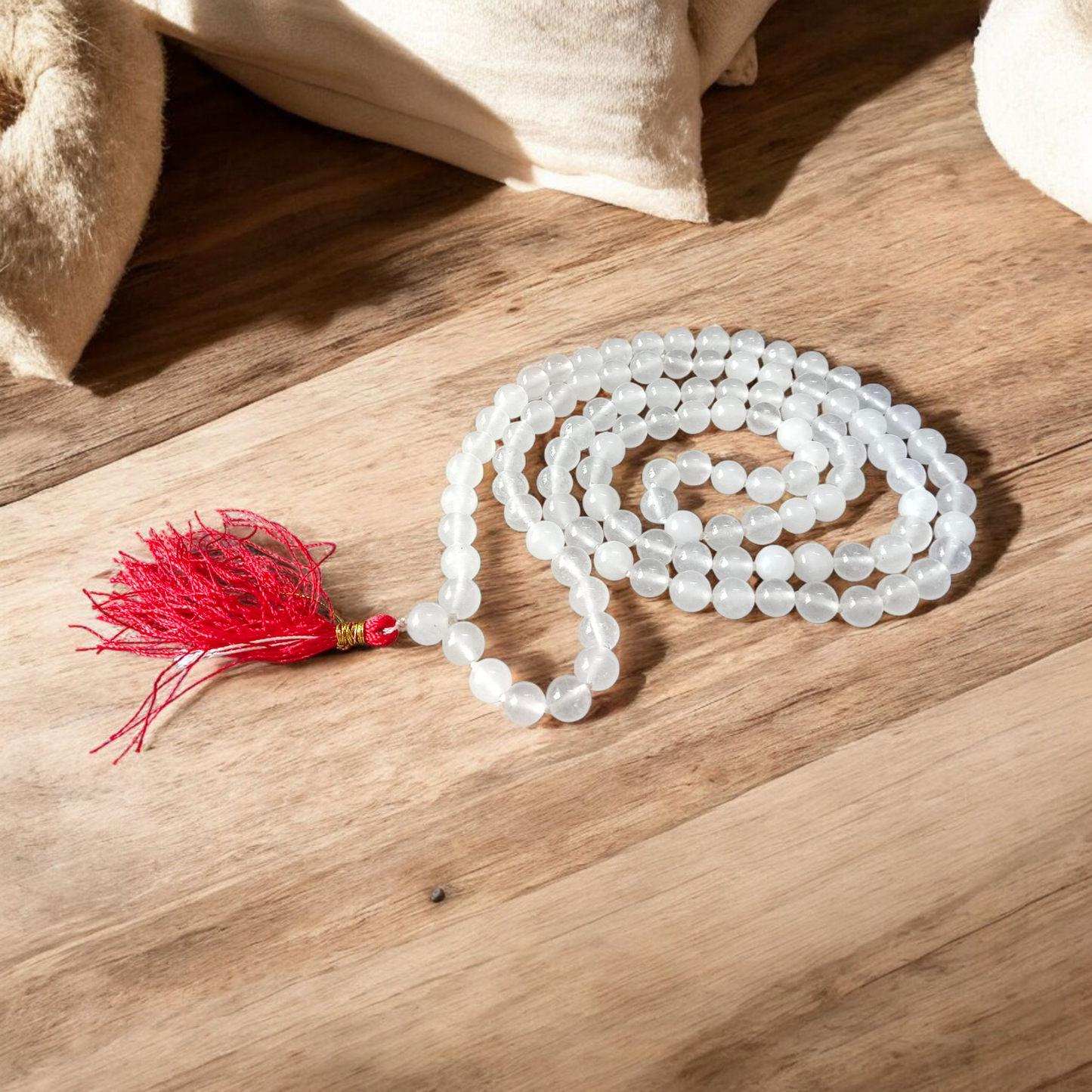 Image showing a set of 4 Jaap Malas – Rudraksha, White Sandalwood, Sphatik, and Red Sandalwood – neatly arranged on a traditional spiritual cloth