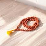 Image showing a set of 4 Jaap Malas – Rudraksha, White Sandalwood, Sphatik, and Red Sandalwood – neatly arranged on a traditional spiritual cloth