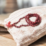 Image showing a set of 4 Jaap Malas – Rudraksha, White Sandalwood, Sphatik, and Red Sandalwood – neatly arranged on a traditional spiritual cloth