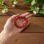 Image showing a stretchable 5 Mukhi Rudraksha bracelet made with 11mm natural brown beads, arranged in a circle on a plain background