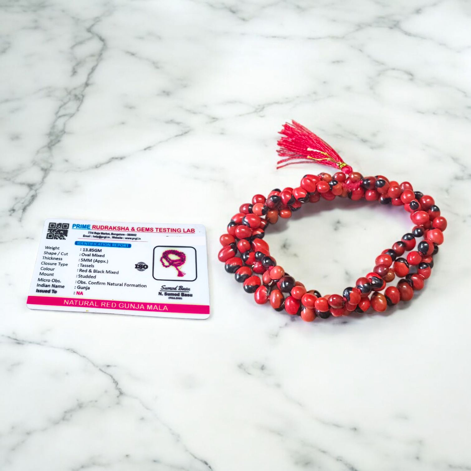 Image showing combo of Lal Gunja Mala and Black Gunja Mala with 108+1 beads, lab certified, placed aesthetically on a spiritual cloth for rituals or meditation