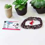 Image showing combo of Lal Gunja Mala and Black Gunja Mala with 108+1 beads, lab certified, placed aesthetically on a spiritual cloth for rituals or meditation