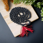 Image showing combo of brown Rudraksha Mala and Black Rudraksha Mala, each with 108+1 beads (8mm), lab certified and arranged on a spiritual cloth background