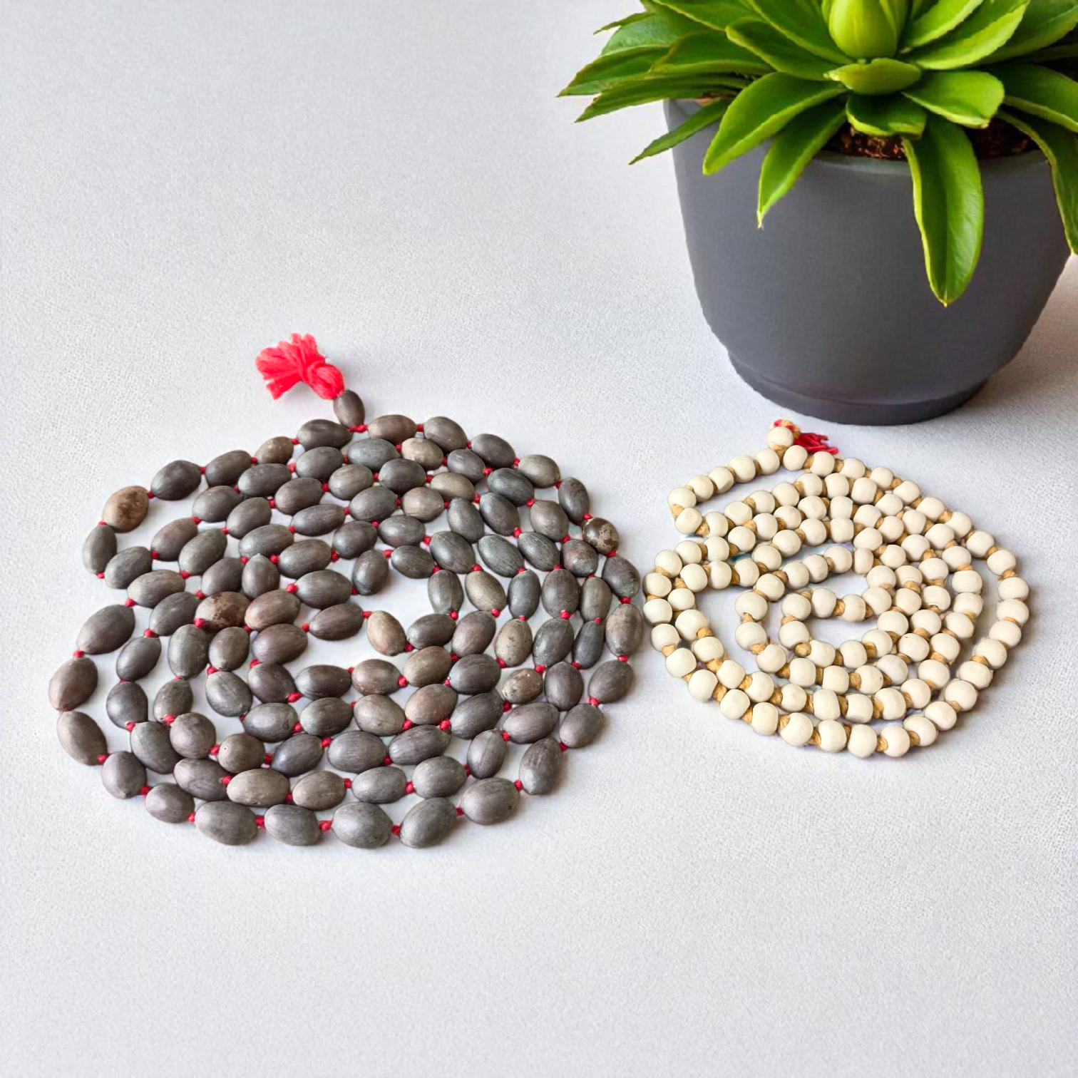 Image showing combo of lab-certified Tulsi Mala and Kamal Gatta Mala with 108+1 beads each, beautifully strung and ideal for meditation and prayer