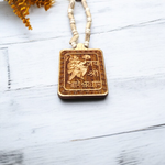 Jai Shri Bageshwar Dham Tulsi Mala with metal locket and screw-lock clasp, displayed against a plain white background