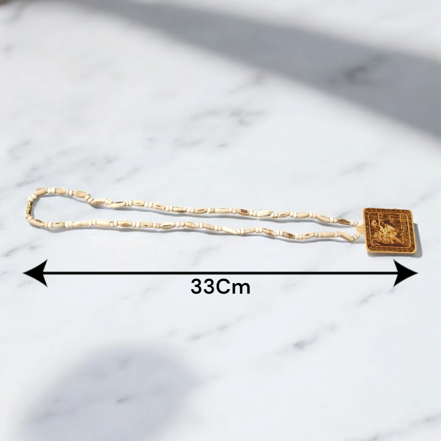 Jai Shri Bageshwar Dham Tulsi Mala with metal locket and screw-lock clasp, displayed against a plain white background