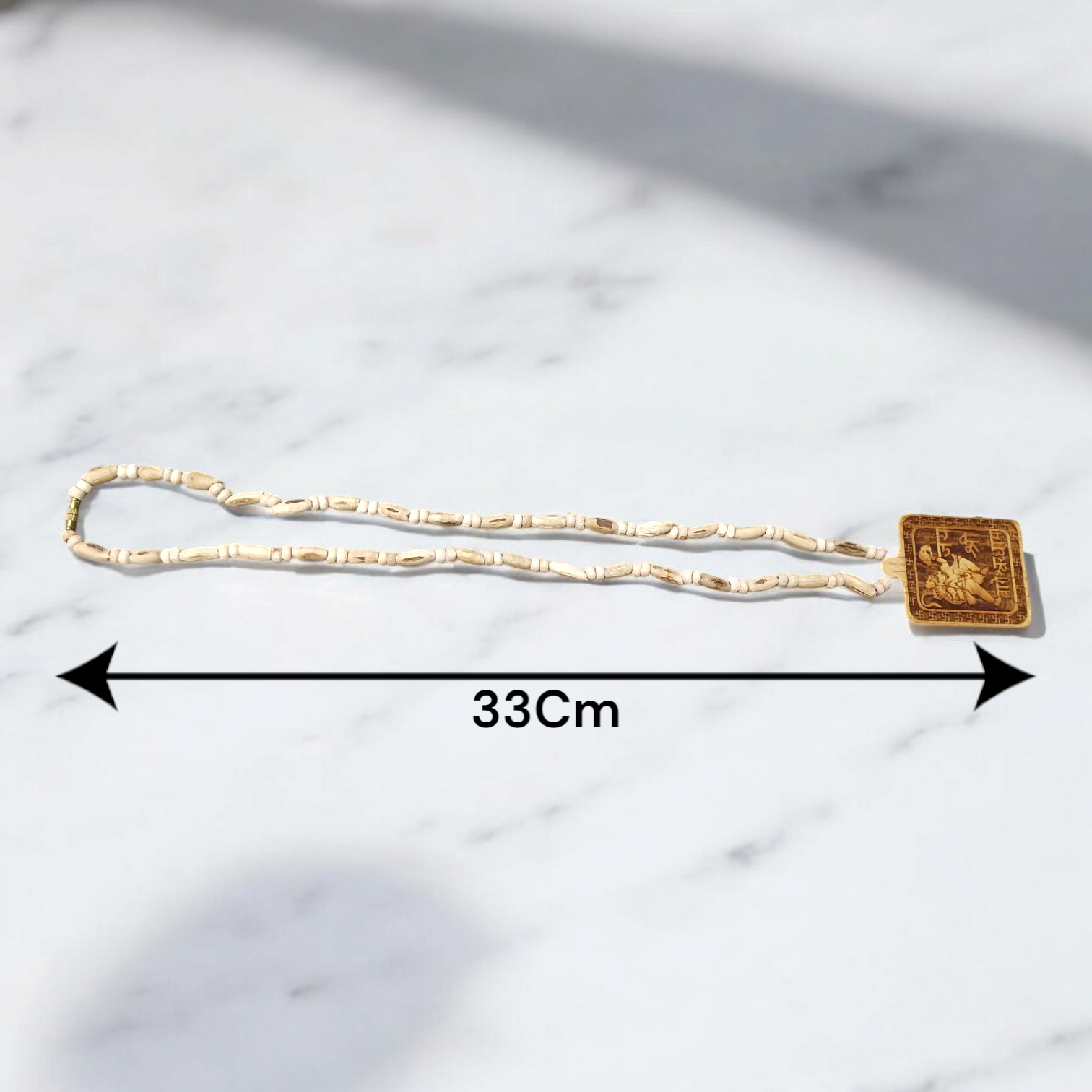 Jai Shri Bageshwar Dham Tulsi Mala with metal locket and screw-lock clasp, displayed against a plain white background