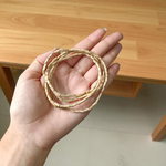 Lab-certified natural Tulsi mala with small round beads, traditionally knotted and displayed on a soft spiritual background