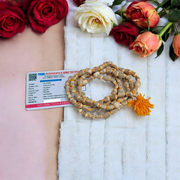 Lab-certified small bead Tulsi Kanthi Mala with double strands, displayed on a traditional wooden background