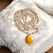 Lab-certified small bead Tulsi Kanthi Mala with double strands, displayed on a traditional wooden background