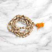 Lab-certified small bead Tulsi Kanthi Mala with double strands, displayed on a traditional wooden background