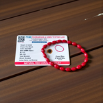 Lab certified Lal Monga (Red Coral) bracelet with polished red beads, ideal for energy, confidence, and astrological balance