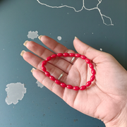 Lab certified Lal Monga (Red Coral) bracelet with polished red beads, ideal for energy, confidence, and astrological balance