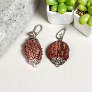 Lab certified pendant featuring 3 Mukhi and 5 Mukhi Rudraksha beads set in a polished metal cap design, used for spiritual transformation and protection
