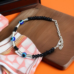 Lightweight black beads anklet with evil eye charm for kids, designed for spiritual protection and daily comfort, by MALAWALA