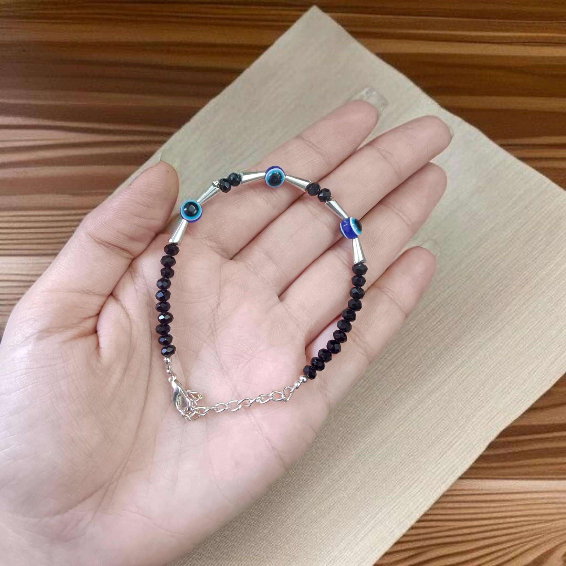 Lightweight black beads anklet with evil eye charm for kids, designed for spiritual protection and daily comfort, by MALAWALA