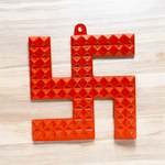 Metal Swastik wall hanging with 68 embedded Vaastu pyramids, measuring 10x10 cm, ideal for correcting Vaastu dosh in homes and offices