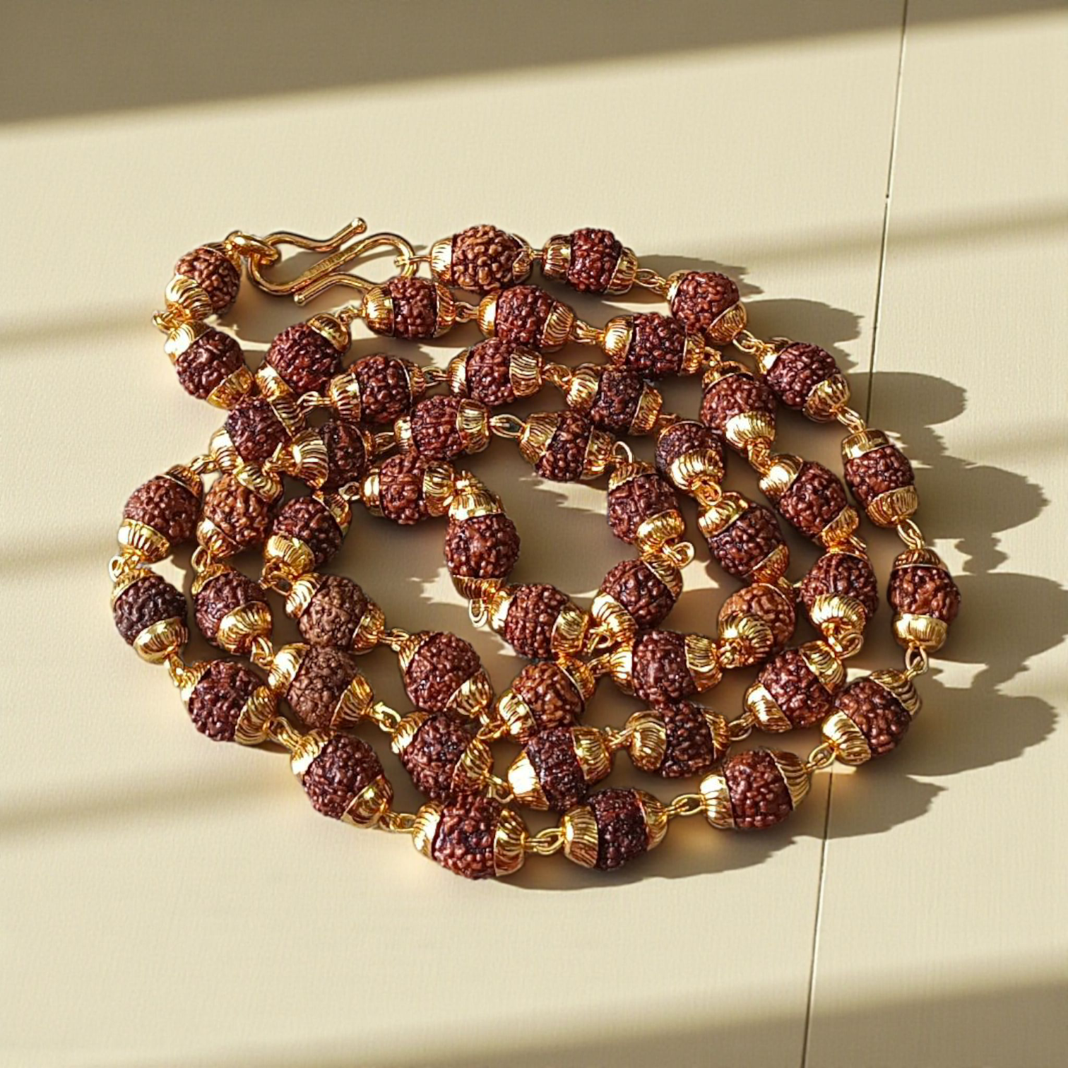Natural 5 Face Rudraksha Mala with 50 golden-capped 6mm beads, handcrafted and lab-certified, ideal for meditation and daily wear with 1-year plating guarantee