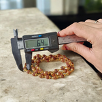 Natural 5 Face Rudraksha Mala with 50 golden-capped 6mm beads, handcrafted and lab-certified, ideal for meditation and daily wear with 1-year plating guarantee