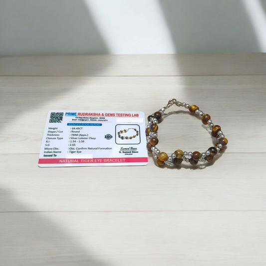 Natural Blue Chalcedony Bracelet made with 8mm smooth round stretchable beads, lab certified, placed on a natural stone background