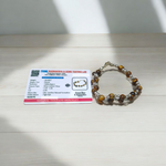 Natural Blue Chalcedony Bracelet made with 8mm smooth round stretchable beads, lab certified, placed on a natural stone background