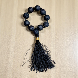 Natural Lava Finger Mala with 9+1 black porous lava beads, handcrafted for meditation and healing, displayed on a white background