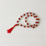 Natural Rudraksha and Sphatik crystal mala with 54+1 hand-strung 7-8mm beads, alternating design, placed on a plain background