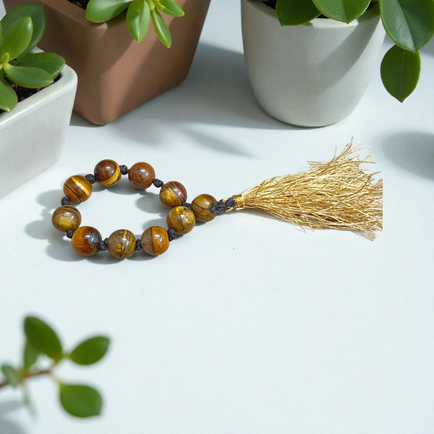 Natural Tiger Eye Finger Mala with 9+1 lab-certified golden-brown beads, handcrafted for meditation, focus, and willpower enhancement by MALAWALA