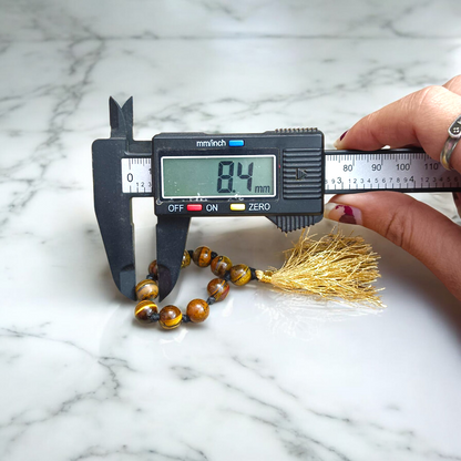 Natural Tiger Eye Finger Mala with 9+1 lab-certified golden-brown beads, handcrafted for meditation, focus, and willpower enhancement by MALAWALA