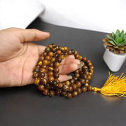 Natural Tiger Eye Mala with 108+1 beads and guru bead, handcrafted and polished, used for meditation and protection