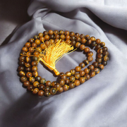 Natural Tiger Eye Mala with 108+1 beads and guru bead, handcrafted and polished, used for meditation and protection