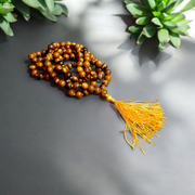 Natural Tiger Eye Mala with 108+1 beads and guru bead, handcrafted and polished, used for meditation and protection