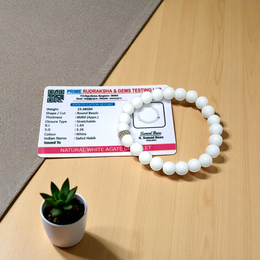 Natural White Agate Bracelet with 8mm polished round beads on stretchable thread, displayed on a white background