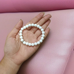 Natural White Agate Bracelet with 8mm polished round beads on stretchable thread, displayed on a white background
