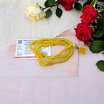 Natural Yellow Agate (Hakik) mala with 108+1 polished 6mm gemstone beads, hand-knotted with a guru bead, displayed on a neutral background
