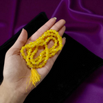 Natural Yellow Agate (Hakik) mala with 108+1 polished 6mm gemstone beads, hand-knotted with a guru bead, displayed on a neutral background